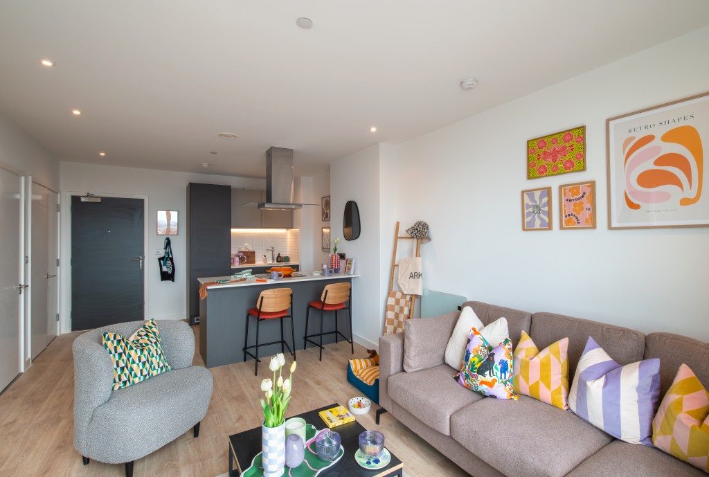 Bright one bedroom apartment at Eda Salford Quays with corner sofa and floor-to-ceiling windows